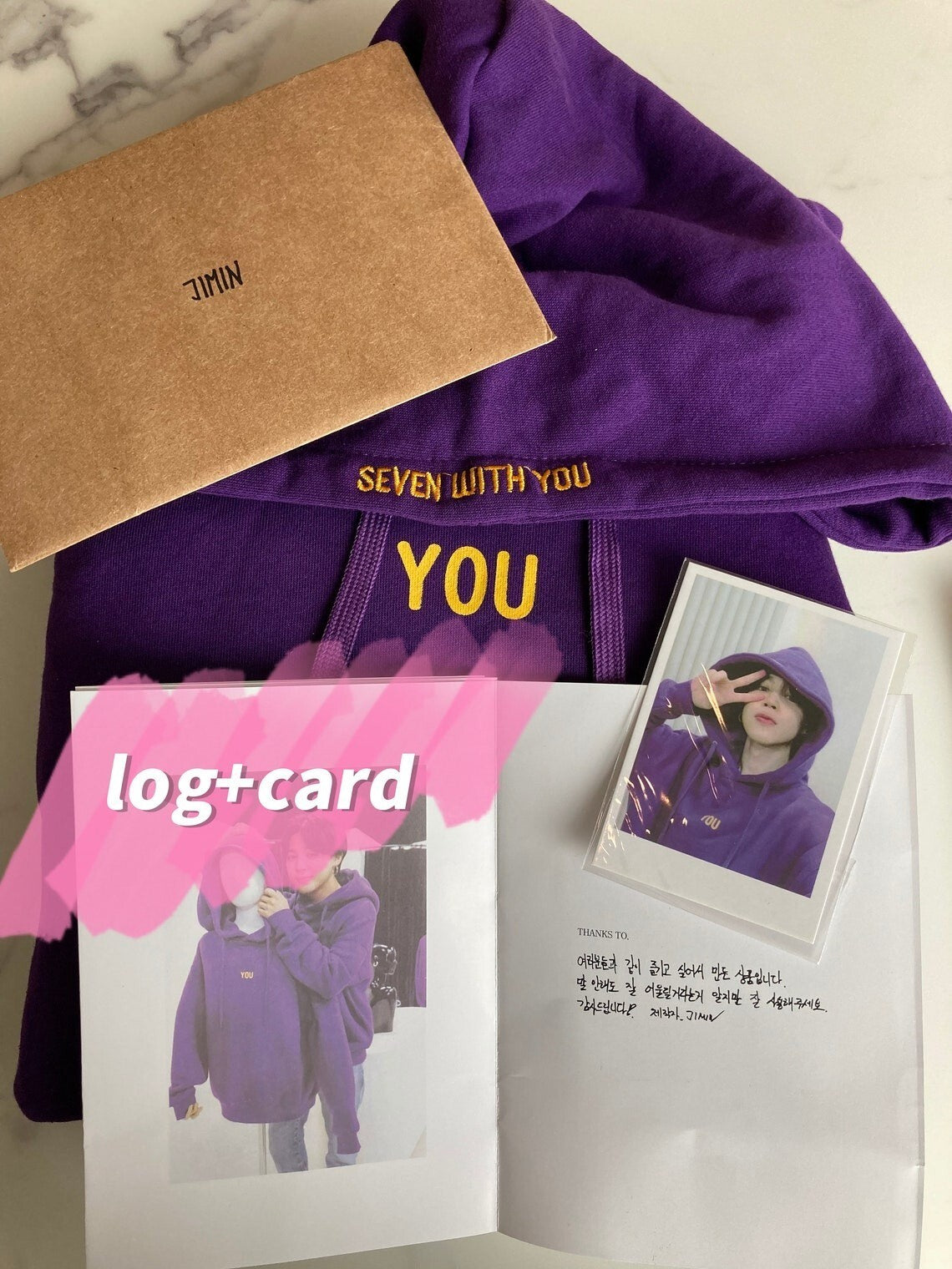 Purple Seven With You hoodie with accompanying photocard and printed design log