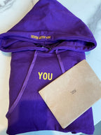 Seven With You lettering on the purple hood and yellow YOU chest design