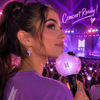 BTS-inspired purple light stick earrings styled for a concert outfit
