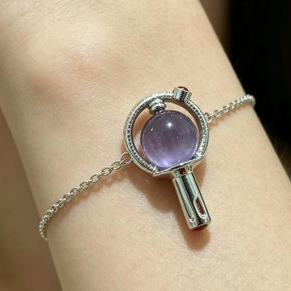 Close-up of BTS-inspired purple light stick chain bracelet