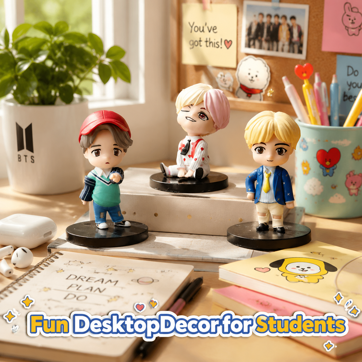 Three BTS-inspired mini figures displayed on a student desk