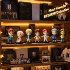 Complete seven-member BTS mini figure set in a warm shelf display
