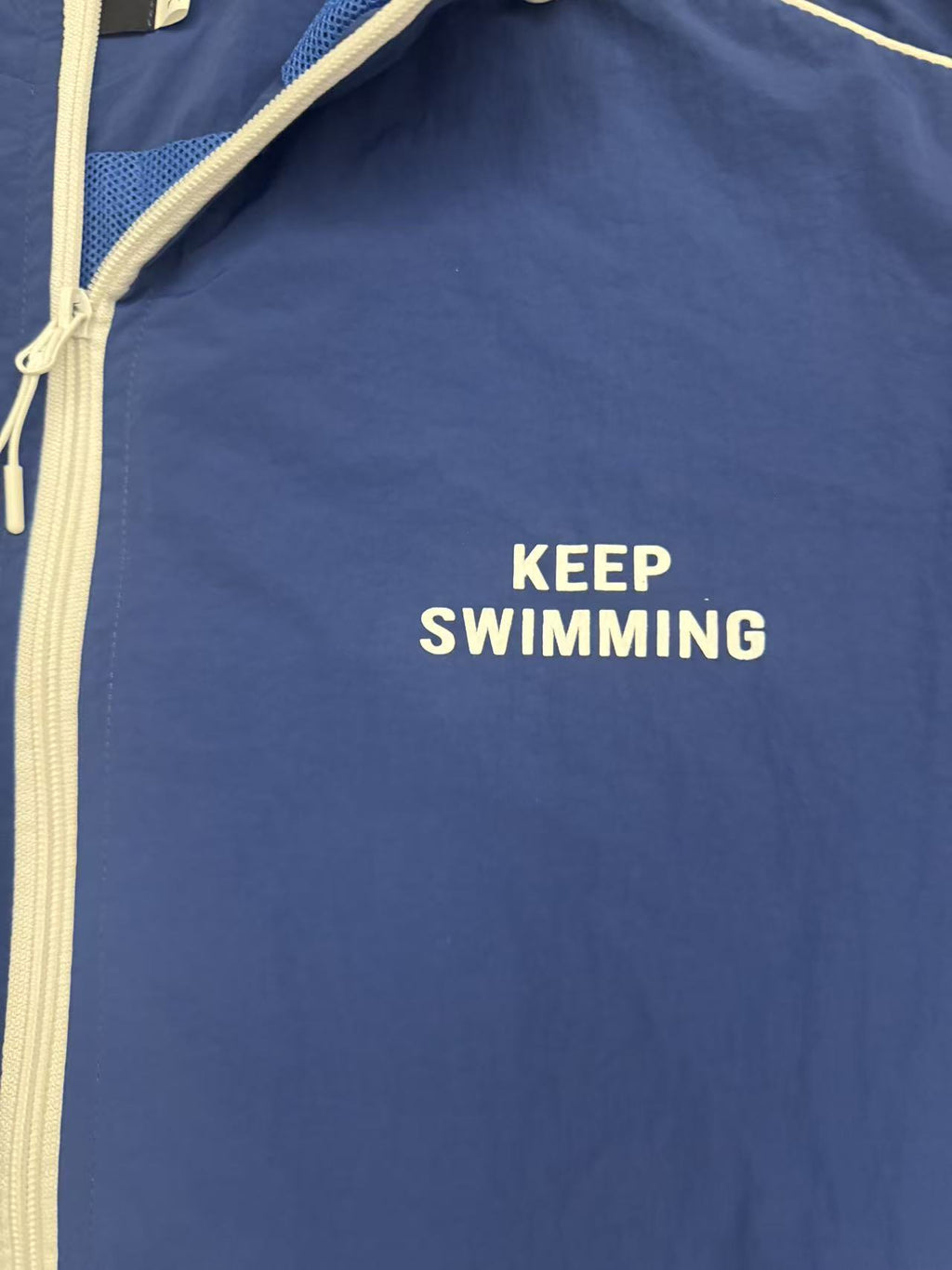 KEEP SWIMMING chest print and zipper detail