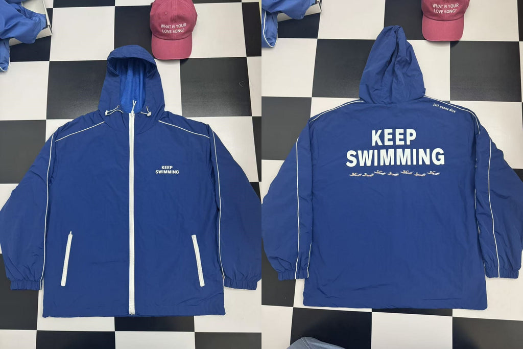 KEEP SWIMMING blue hooded windbreaker jacket product front and back