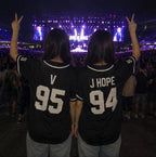 Black BTS baseball jersey back view on model showing custom name